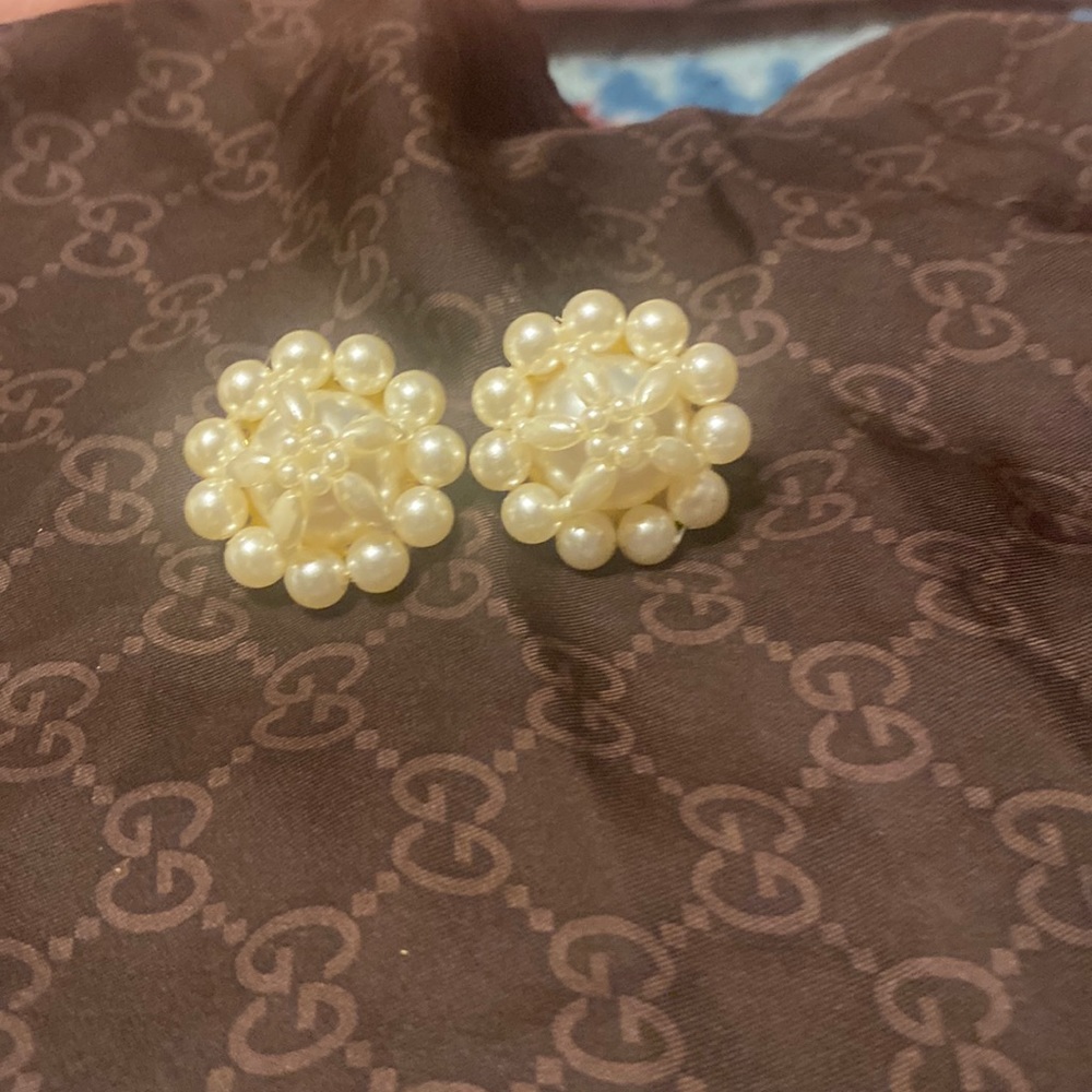 Pearl earrings.